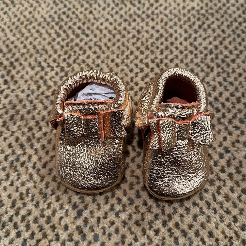 Freshly picked rose gold baby moccasins